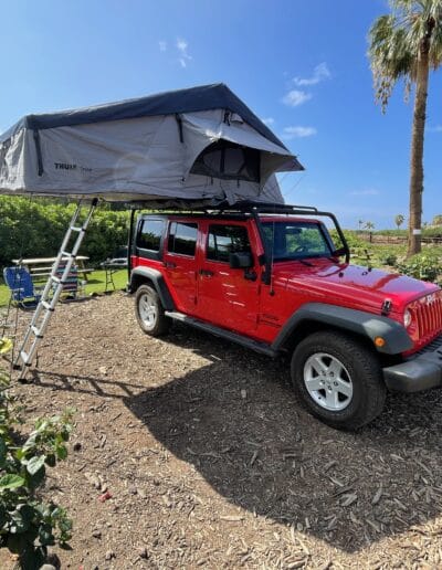 Red Jeep Wrangler with Tepui Rooftop Tent